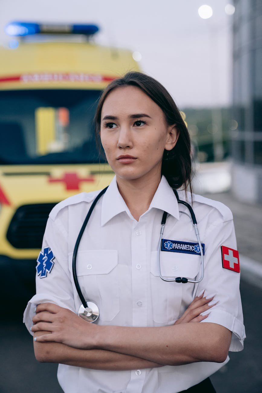 woman in paramedic uniform looking away