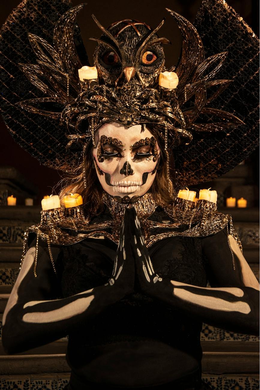 woman wearing a costume for the mexican day of the dead