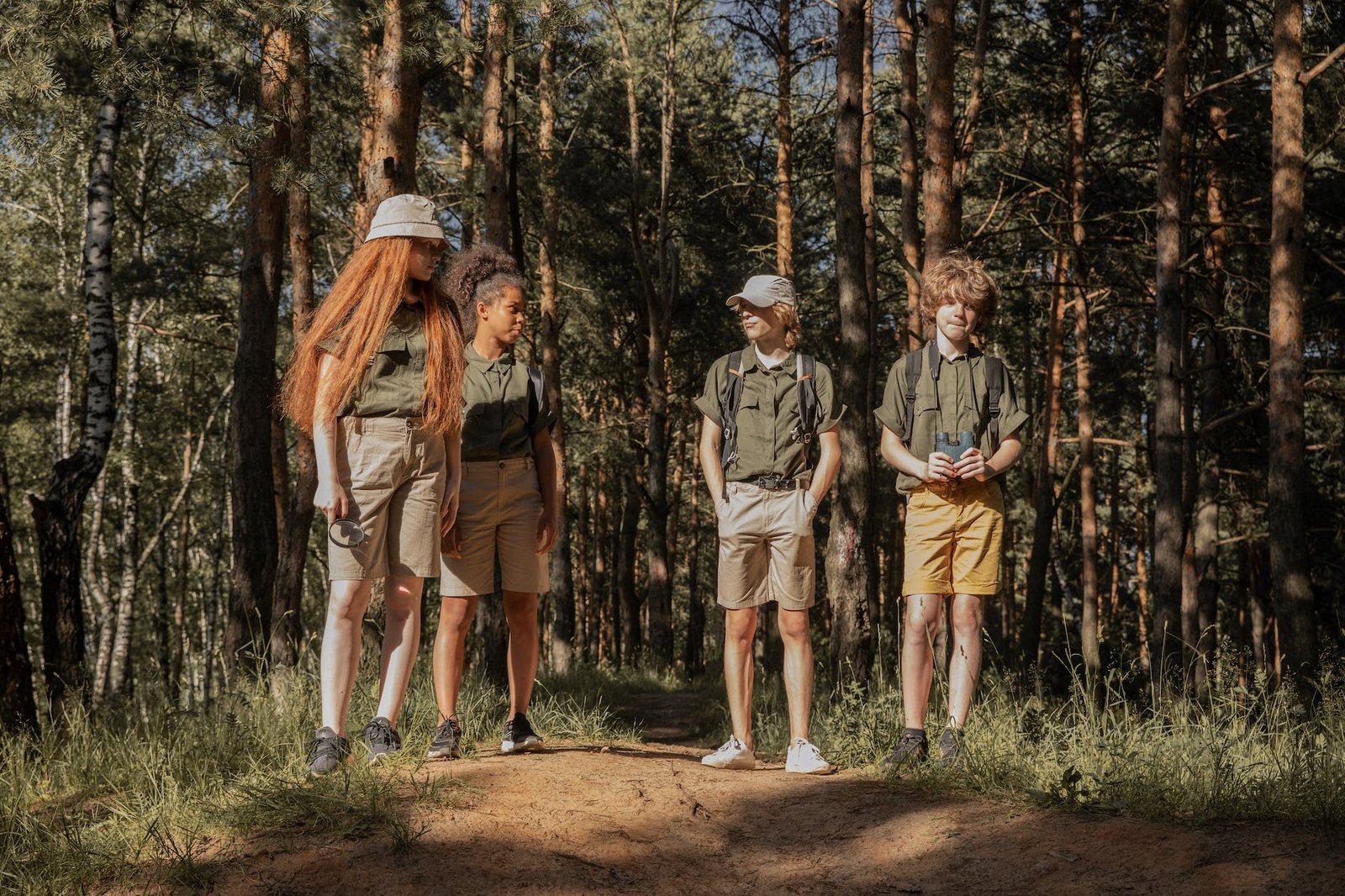 scouts standing in forest